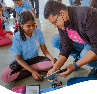 Student learning about Quarky from an expert trainer